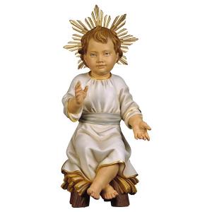 Niño Jesús sentado en cuna con Aureola